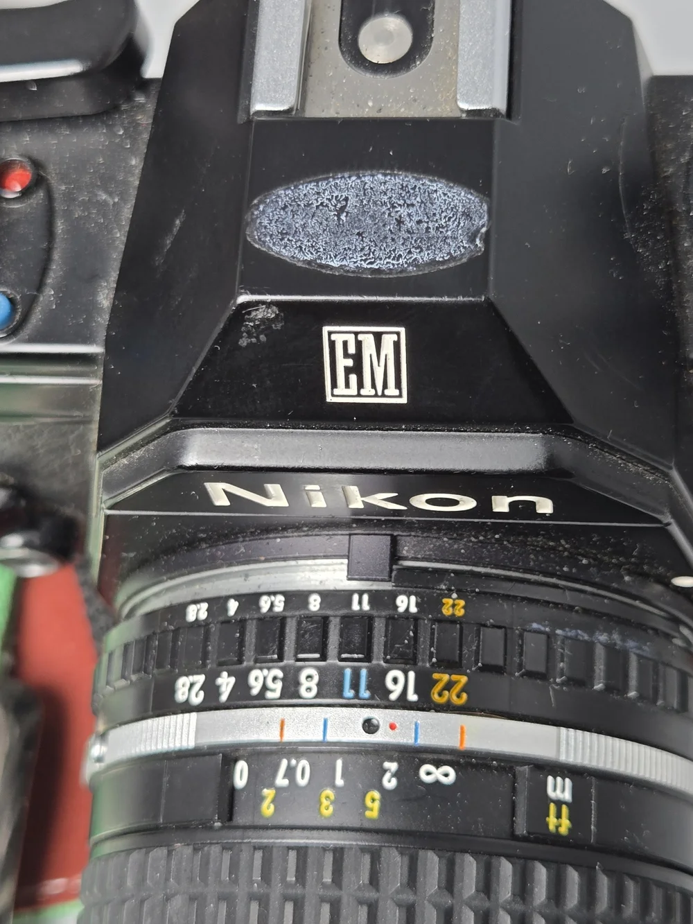 Nikon EM 35mm Film Camera Kit with 28mm, 50mm, 70-210mm Series E Lenses, SB-E Fl